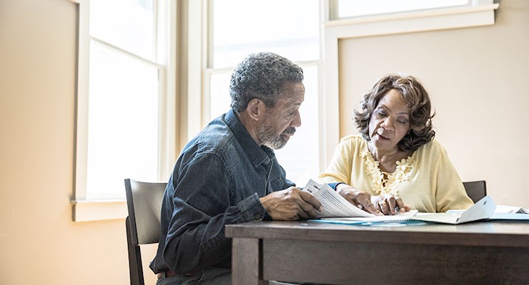 image of man and woman sitting at a desk